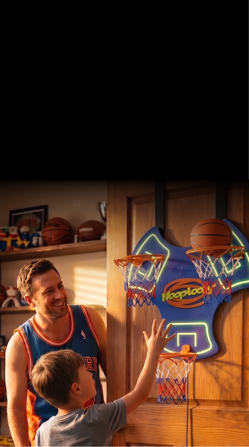Man and child playing with a basketball hoop in a room with sports memorabilia.